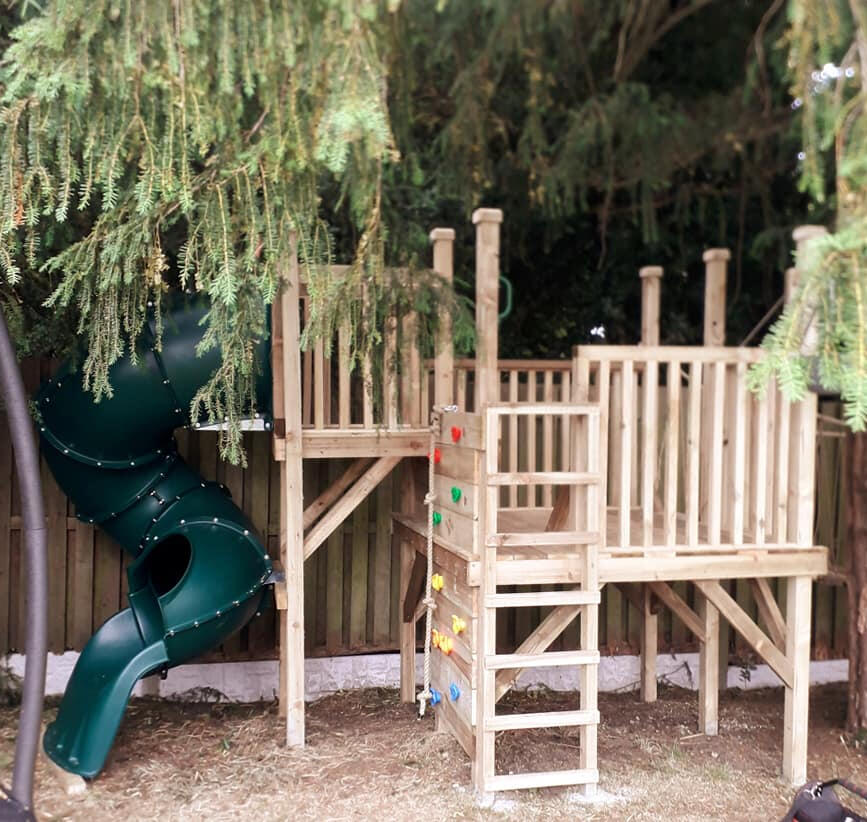 The climbing wall and tubular slide