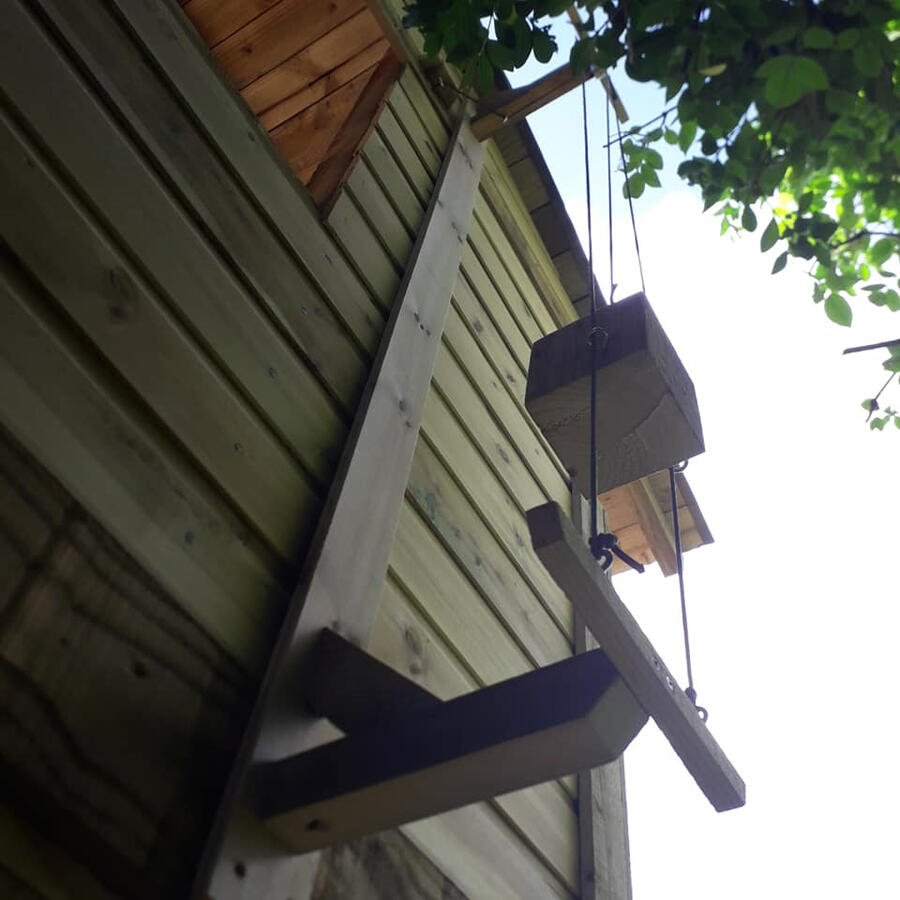 The counterwight at the back of the treehouse